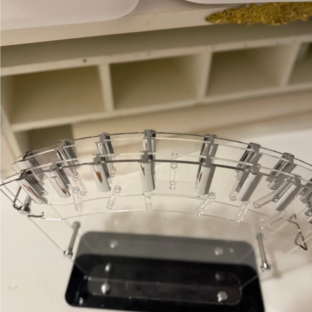 clear acrylic knife block or stand, designed to hold and display kitchen knives.